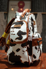 Load image into Gallery viewer, Wrangler: Cowprint Backpack
