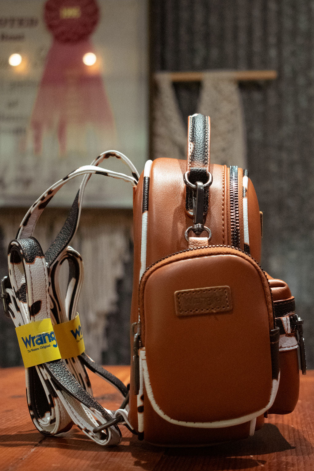 Wrangler: Cowprint Trimmed Mini Backpack